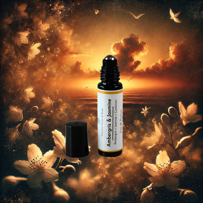 A rollerball perfume labeled "Ambergris & Jasmine" by Couture Home & Body is set against a dreamy, warm-toned background with glowing clouds and floating white flowers. The scene evokes a sense of mystery and elegance.