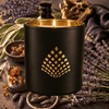 Black Amber & Lavender candle in a black jar with gold interior.