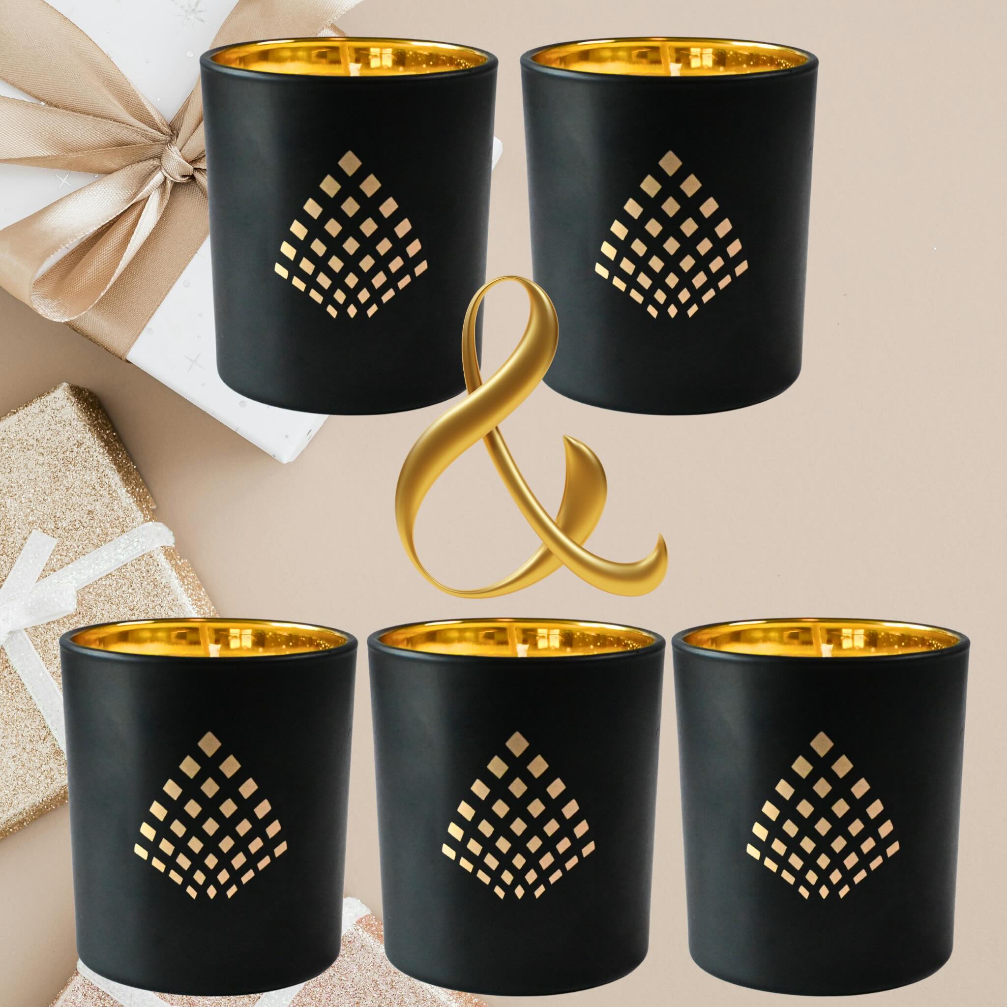 Set of five black candles with gold geometric patterns on a beige background.