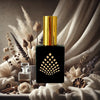 Perfume bottle with gold cap and black base featuring a geometric design, surrounded by flowers and herbs.