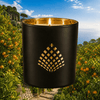 Citrus Grove candle in a black jar with gold interior.