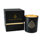 A black and gold Couture Home & Body candle with matching black and gold packaging, showcasing a luxurious and elegant design.