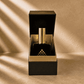Couture Home & Body perfume inside box in a sunlight room.