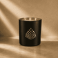 A black and gold Couture Home & Body candle, showcasing a luxurious and elegant design.