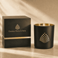 A black and gold Couture Home & Body candle with matching black and gold packaging, showcasing a luxurious and elegant design.