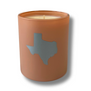 Dusty Rose candle jar in a brown kraft box with a Texas-shaped cutout on a white background.