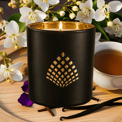 Golden Hour candle in a matte black glass jar with gold interior.