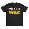 Black t-shirt with “Put It In Wax” slogan in bold white and yellow neon lettering.
