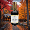 Room & Linen Mist bottle labeled 'Quiet Season' with a scenic autumn background featuring a house.