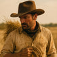 Man in a cowboy hat holding a rope in a desert setting