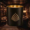 Speakeasy candle infused with cherrywood, tobacco, and leather in a matte black jar with gold interior.