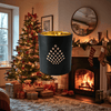 Decorative candle in a festive living room with a Christmas tree and fireplace.